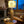 Holz-Tischlampe mit Edelweiss-Lampenschirm im gemütlichen Wohnraum